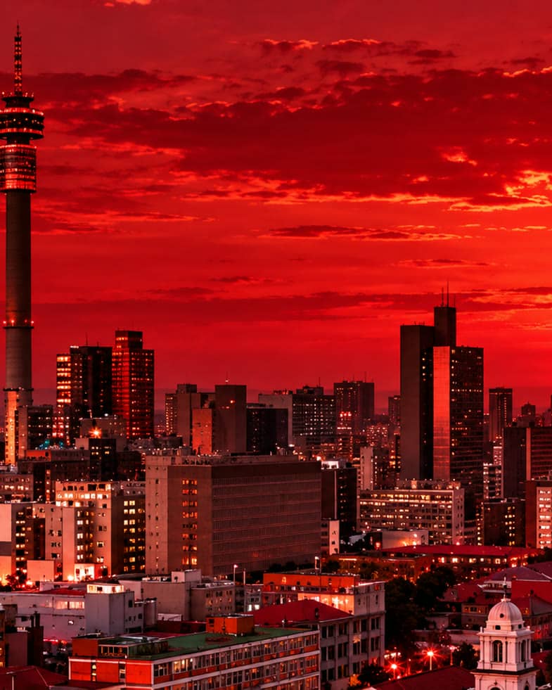 Johannesburg skyline at sunset with the Hillbrow Tower rising over the CBD high-rises